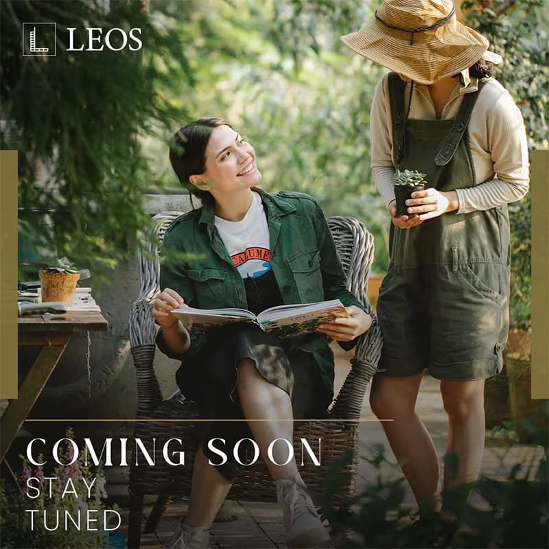 LEOS teaser creative captioned Coming Soon Stay Tuned, showing two people gardening on a planted terrace